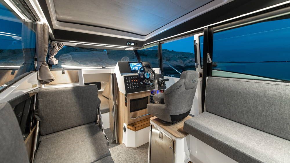 Gran Coupe 905 cabin at night lit up