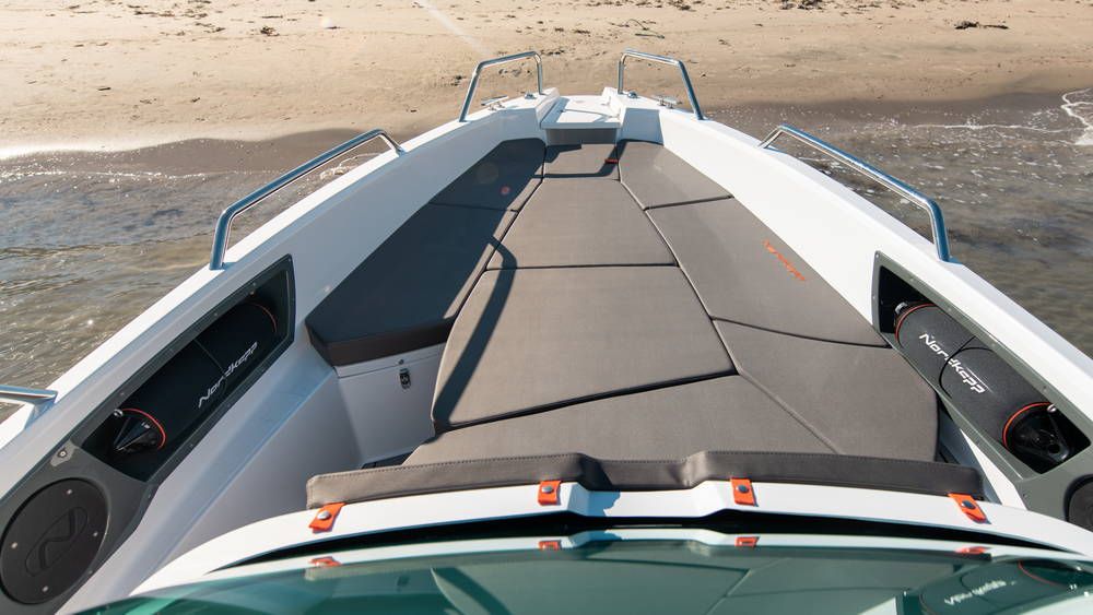 Nordkapp Enduro 705 bow lounge seats next to beach